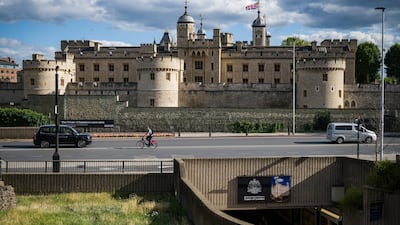 A man cycles past the Tower of London. Getty Images