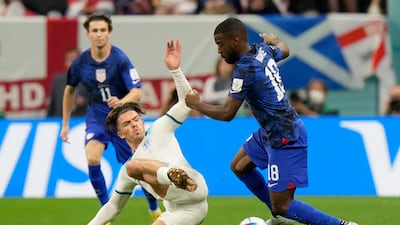 England's Jack Grealish goes to tackle Shaq Moore of the United States. AP