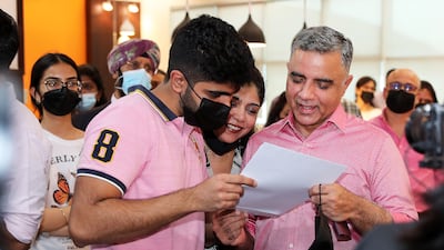 Varun Pabreja with his parents after receiving his IB results at Gems Modern Academy.