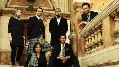 Scotland's Islamic Tartan was released in 2012, modelled on the grand staircase of Glasgow's City Chambers. From left to right, standing: Shabnum Mustapha, Azeem Ibrahim, Shaikh Amer Jamil, Osama Saeed; Sitting: Shazia Akhtar, Humza Yousaf. Courtesy Islamic Tartan