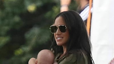 Meghan, Duchess of Sussex holds baby Archie at the Royal Charity Polo Day. AP