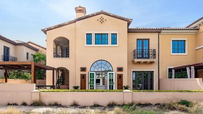 The property back on to the golf course. Courtesy LuxuryProperty.com