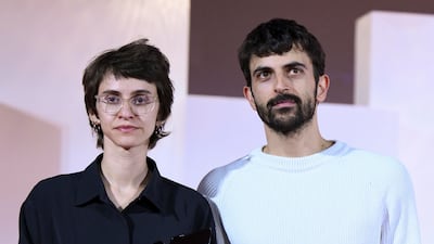 Israeli directors Rachel Szor, left, and Yuval Abraham with their Special Jury Prize for Naza, at the Venice International Film Festival. EPA