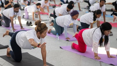 Participants gather under the dome of Louvre Abu Dhabi for a special International Day of Yoga celebration.