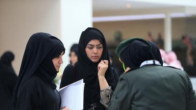 Jobseekers at the recruitment fair in Abu Dhabi yesterday are briefed on the careers available in the Armed Forces. Ravindranath K / The National
