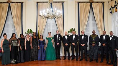 Prince William and Kate pose for a picture with Mr Allen, his wife Patricia, and Mr Holness. Reuters