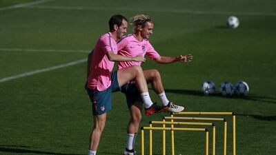 Antoine Griezmann, right, and Atletico Madrid teammate Diego Godin take part in training. Gonzalo Arroyo Moreno / Getty Images