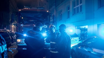 Emergency service and firefighters stand in front of the Eurostars David hotel in Prague, Czech Republic. Martin Divisek/ EPA