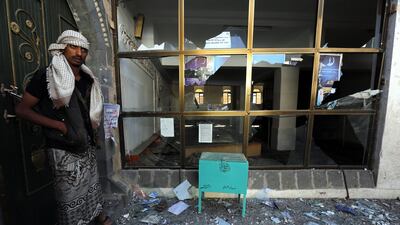 Yemenis inspect the scene of a suicide attack inside a mosque during prayers for Eid Al Adha in Sanaa on Thursday. Yahya Arhab / EPA