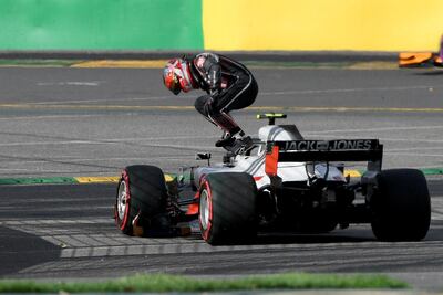 Kevin Magnussen climbs out of his Haas car after a break down during the Australian Grand Prix. EPA