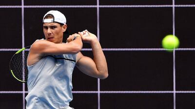Rafael Nadal hits a backhand return during a training session. William West / AFP