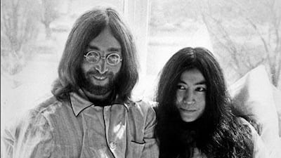 John Lennon and his wife Yoko Ono receive journalists 25 March 1969 in the bedroom of the Hilton hotel suite in Amsterdam, during their honeymoon in Europe.