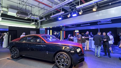 Participants get a change to overlook a display model. Courtesy Abu Dhabi Motors