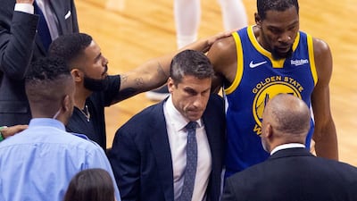 Golden State Warriors forward Kevin Durant, right, is consoled by Drake as he walks off the court after sustaining an injury during first half. AP Photo