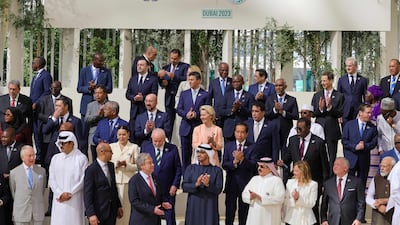 While world leaders pose for photos at Cop28, negotiations on the global stocktake are beginning in the background. AFP