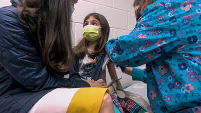 Alejandra Gerardo, 9, is given the first of two Pfizer Covid-19 vaccinations during a clinical trial for children at Duke Health in Durham, US. AP
