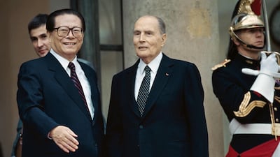 Jiang Zemin meets France's President Francois Mitterrand in Paris, September 9, 1994. AFP