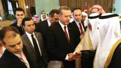 The Turkish prime minister, Recep Tayyip Erdogan, centre, greets dignitaries in Saudi Arabia.
