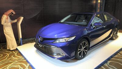 The new Toyota Camry HEV is unveiled at the InterContinental Festival City in Dubai. Satish Kumar for The National