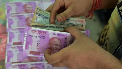 With India's growing demand for oil, the rupee could play an increasingly bigger role in the oil markets with contracts being denominated in the currency. AFP