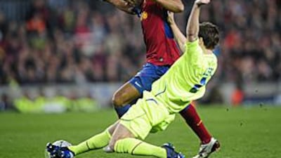 Barcelona's Thierry Henry, right, takes on Lyon's Kim Kallstrom during their second leg match in the Camp Nou.