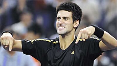 The Serbian Novak Djokovic celebrates his victory over the Russian Nikolay Davydenko in the men's singles final at the ATP Masters Cup.