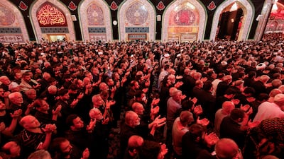 Shi'ite Muslim pilgrims attend prayers during the holy Shi'ite ritual of Arbaeen at the shrine of Imam Hussein, in the holy city of Kerbala.