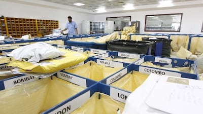 Rain, hail, sleet or snow … The National gets a tour through Emirates Post’s mail-sorting centre in Umm Ramool, Dubai. Jeffrey E Biteng / The National