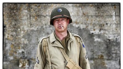 Martin Elford, from the United Kingdom, wears a replica uniform of a member of the US Army 29th Infantry Division.