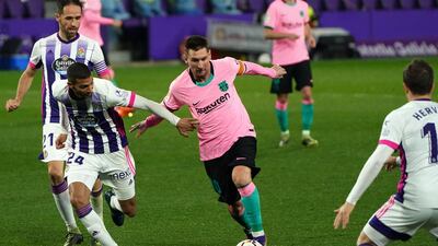 Real Valladolid midfielder Joaquin Fernandez challenges Lionel Messi. AFP