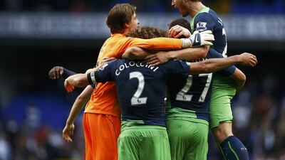 Newcastle United goalkeeper Tim Krul, left, celebrates with teammates as they win their English Premier League match against Tottenham Hotspur at White Hart Lane in London October 26, 2014. REUTERS/Andrew Winning