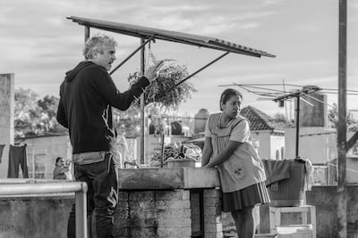 Alfonso Cuaron, left, and actress Yalitza Aparicio on the set of 'Roma'. Netflix via AP