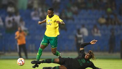Al Khaleej defender Omar Al Owdah skips a challenge from Al Ahli winger Allan Saint-Maximin. Getty