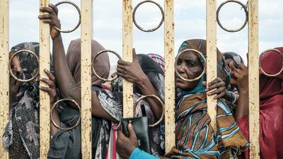 Sudanese wait for cash handouts from the World Food Programme at a camp for internally displaced people in Port Sudan in October. Bloomberg