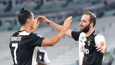 Juventus' Gonzalo Higuain celebrates with his Ronaldo after scoring the third goal. EPA