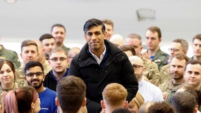 Prime Minister Rishi Sunak subtly hints at election timing amid a backdrop of eager journalists, capturing a moment of political suspense at the heart of British governance. PA