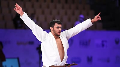 The UAE's Omar Al Fadhli celebrates after winning the final of 62 kg brown belt category against Leonardo Mario of Brazil in the World Professional Jiu-Jitsu championship held at Zayed Sports City’s Jiu-Jitsu Arena in Abu Dhabi on November 18, 2021. Pawan Singh / The National