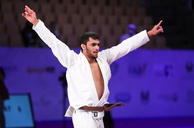 Omar Al Fadhli celebeates his victory at Zayed Sports City’s Jiu-Jitsu Arena in Abu Dhabi. Pawan Singh / The National