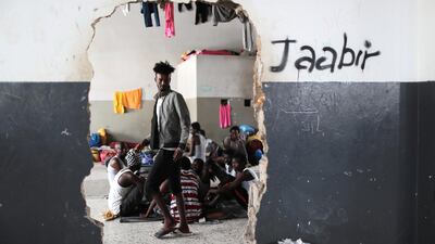 Migrants at Tajora shelter centre feel unsafe to leave. Reuters