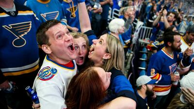 Bill Kess, left, and his friends react as the clock hits zero and the St. Louis Blues win the Stanley Cup over the Boston Bruins in Boston, during a watch party at Enterprise Center in St. Louis. AP
