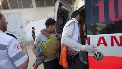 A wounded Palestinian boy is rushed into a red crescent ambulance after an Israel air strike in Zeitune , Gaza July 11, 2014. Heidi Levine for The National