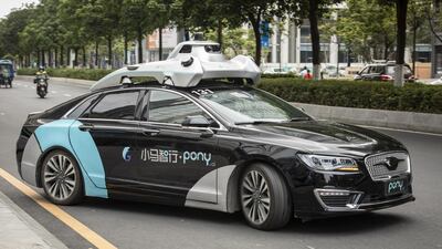 A Pony.ai Inc. autonomous vehicle travels along a road during a demonstration in the Nansha district of Guangzhou, Guangdong Province, China, on Wednesday, April 10, 2019. Domestic and foreign testers are putting cars, buses, trucks and delivery vans through self-driving trials to teach them how to navigate the notoriously congested streets of the world's biggest auto market. Photographer: Qilai Shen/Bloomberg