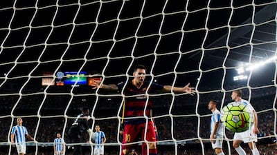 Lionel Messi of Barcelona celebrates after teammate Thomas Vermaelen's goal on Saturday in their win over Malaga. Alex Caparros / Getty Images / August 29, 2015