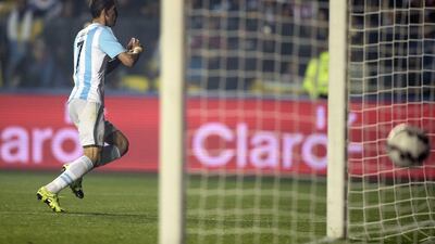 Argentina's Angel Di Maria celebrates after scoring his side's third goal to make it 3-1 against Paraguay on Tuesday night in the Copa America semi-final. Juan Mabromata / AFP