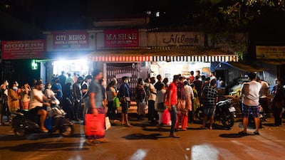 People lineup outside stores to buy groceries following Indian Prime Minister's announcement of a government-imposed nationwide lockdown. AFP