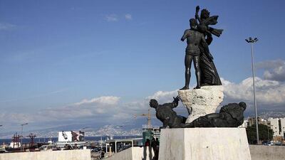 The bomb and bullet-damaged Martyrs' Square monument overlooks the harbour of Beirut.