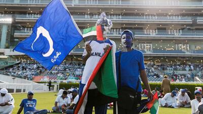 A man carries an Al Hilal flag at Meydan. Reem Mohammed / The National