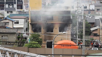 This picture shows a general view of smoke still coming from the building. AFP