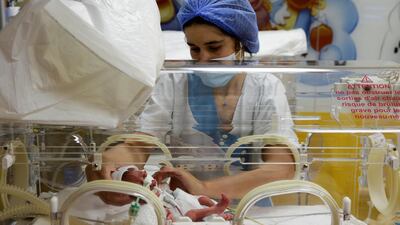 A nurse takes care of one of the nonuplets at the Ain Borja clinic in Casablanca, Morocco. Reuters