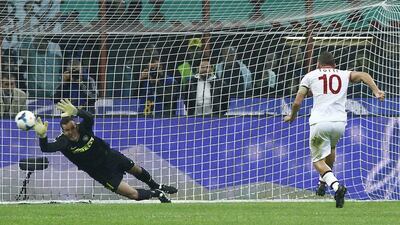 Francesco Totti (right) scores the first of his two goals on a 40th-minute penalty. Spada / AP